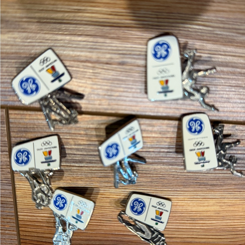 GE Olympic pins - Silver and White collectibles from Winter events